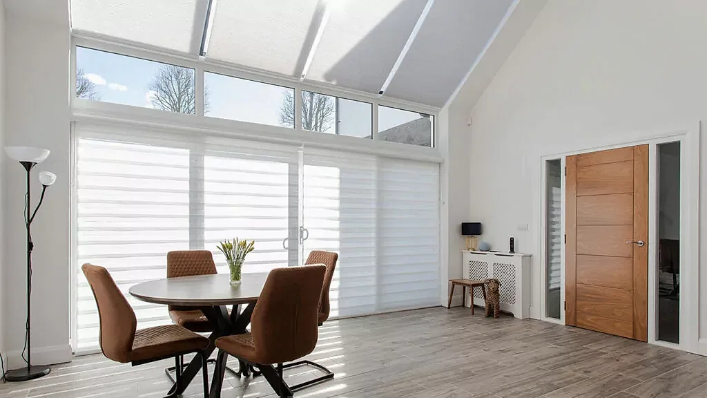 Motorised Window Blinds white Aura Blind and White Cellular Roof Window Blind modern contemporary style home Northern Ireland How are Motorised Window Blinds Powered?