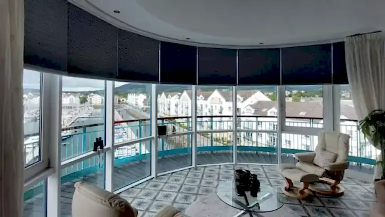 cellular curved blind in modern home in northern ireland living room seaside view on the north coast