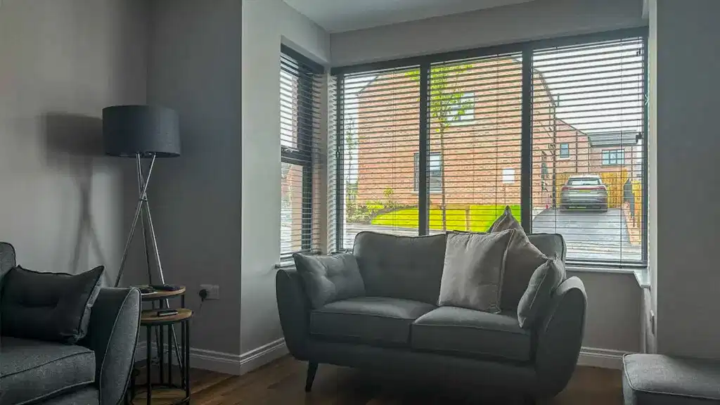 dark wooden blinds living room of a modern contemporary style home in carryduff northern ireland minimalist aesthetic